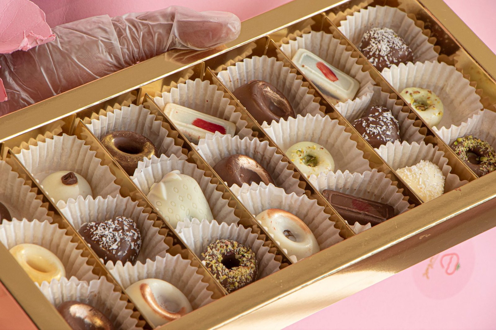 Gold box of assorted gourmet chocolates ready for gifting